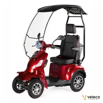 Veleco FASTER red mobility scooter with canopy and captain seat